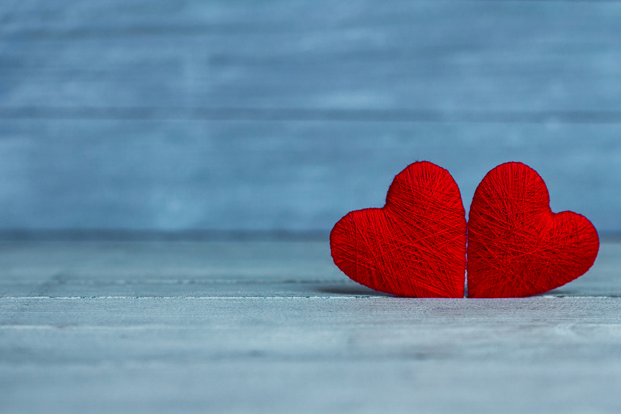 00fb8056 bigstock love hearts on wooden texture 344756827